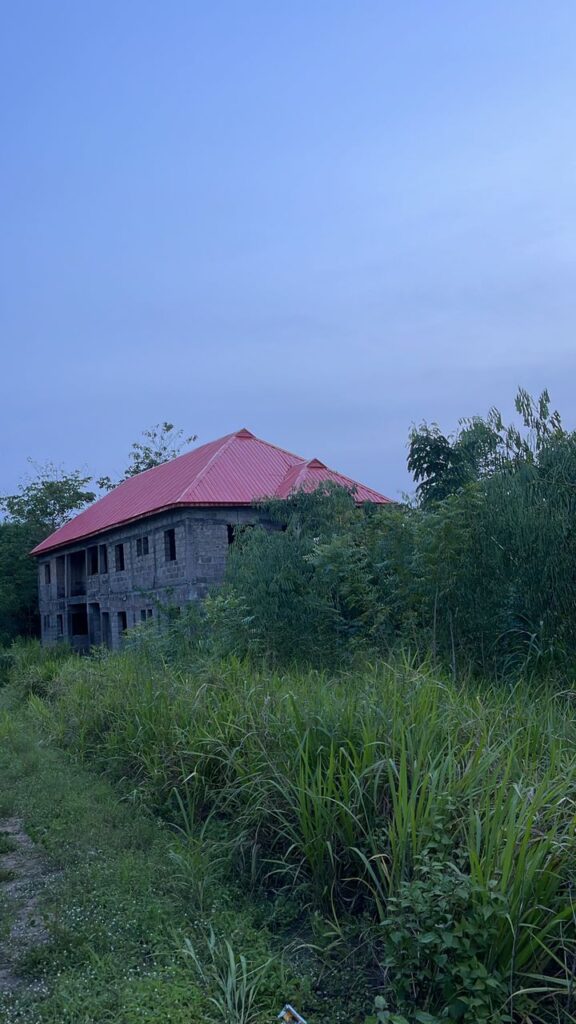 Red aluminium roof on a residential building by Blessed Joe Aluminium.